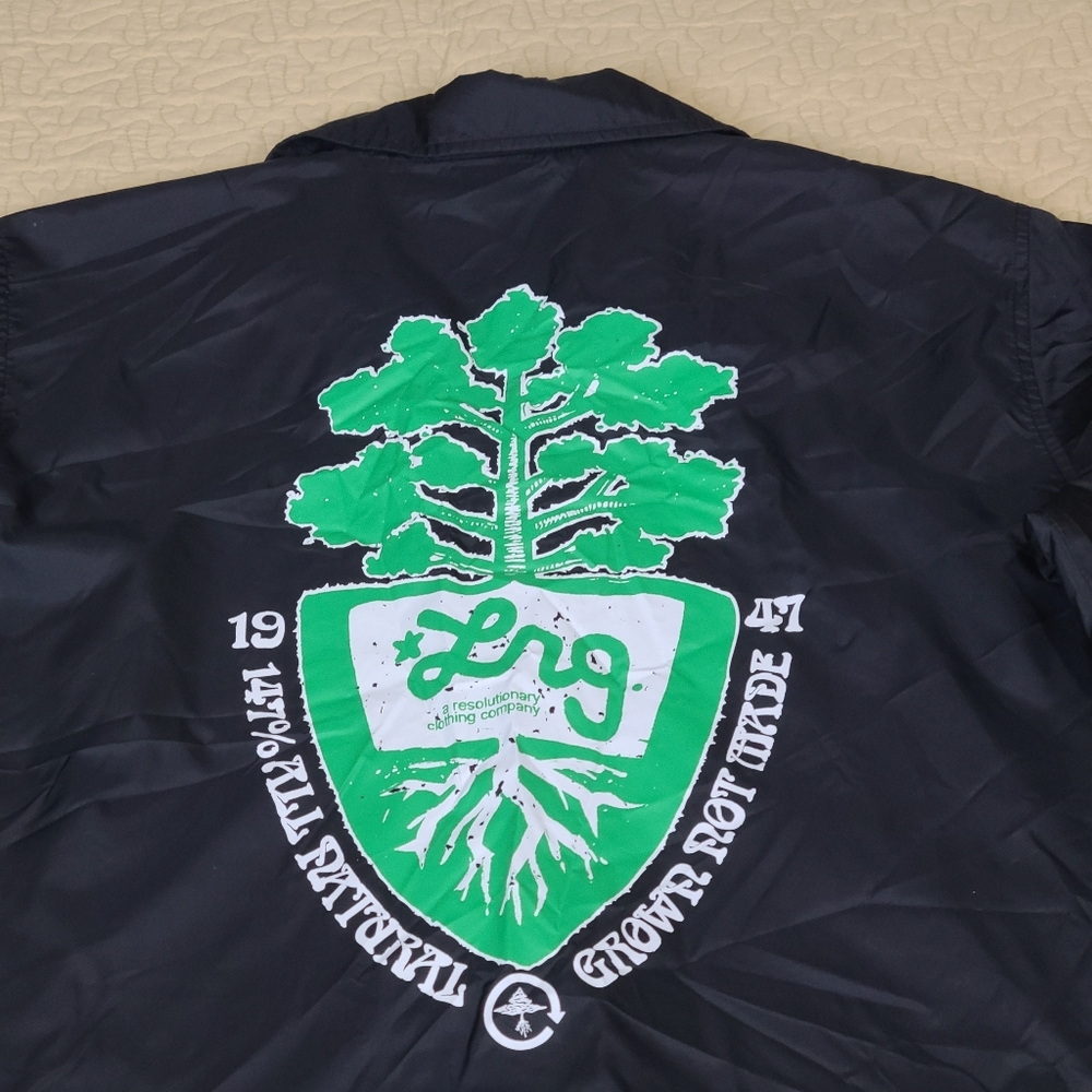 Lrg Black Jacket with Green & White Crest Graphic